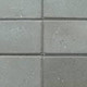 Excluton | Halve betontegel met facet 15x30x4.5 | Grijs