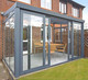 Gardendreams | Tuinkamer met schuifpui en polycarbonaat dakbedekking | 400 x 350 cm
